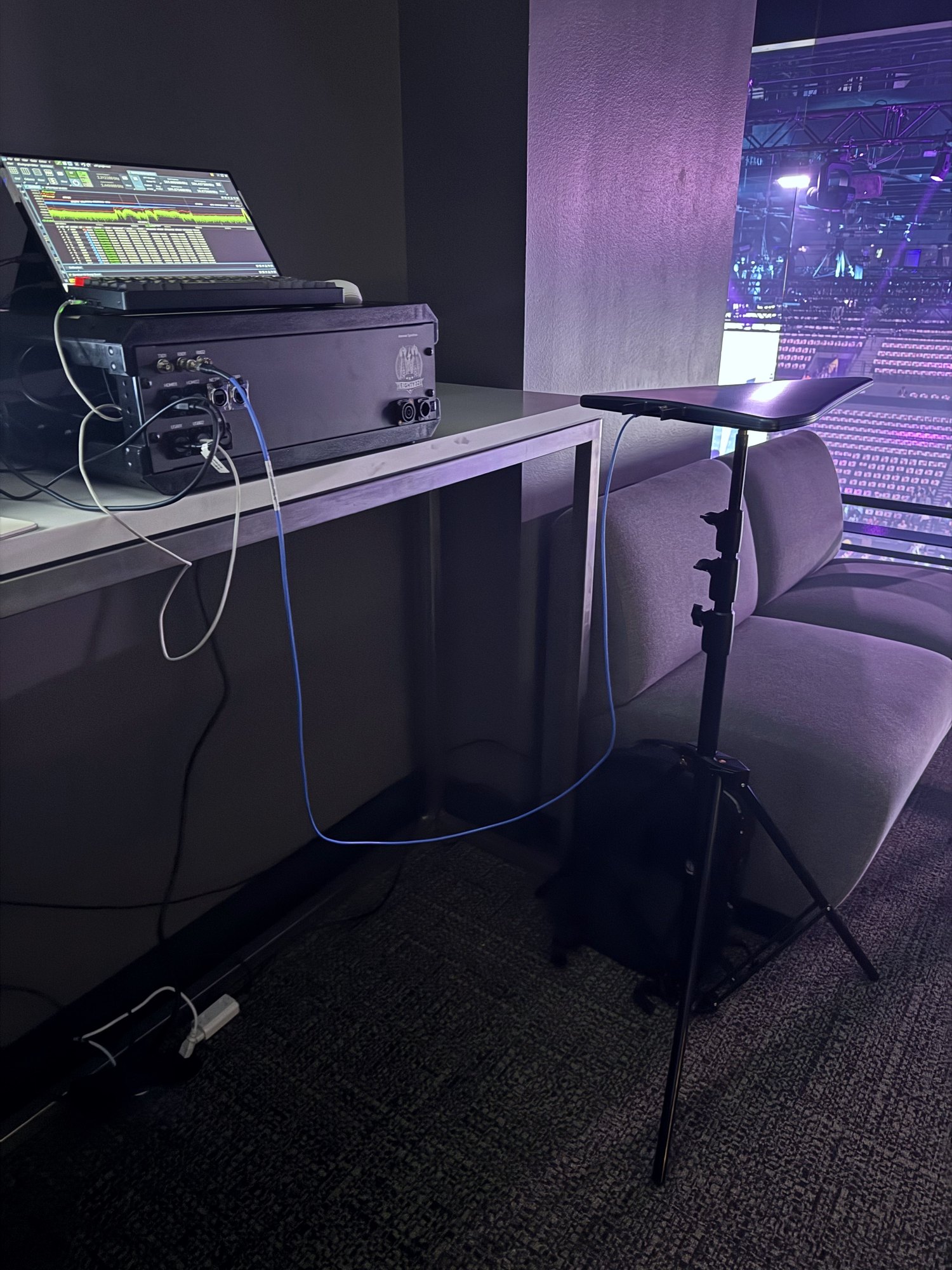 Show AV control deck with confidence monitor and rack at venue